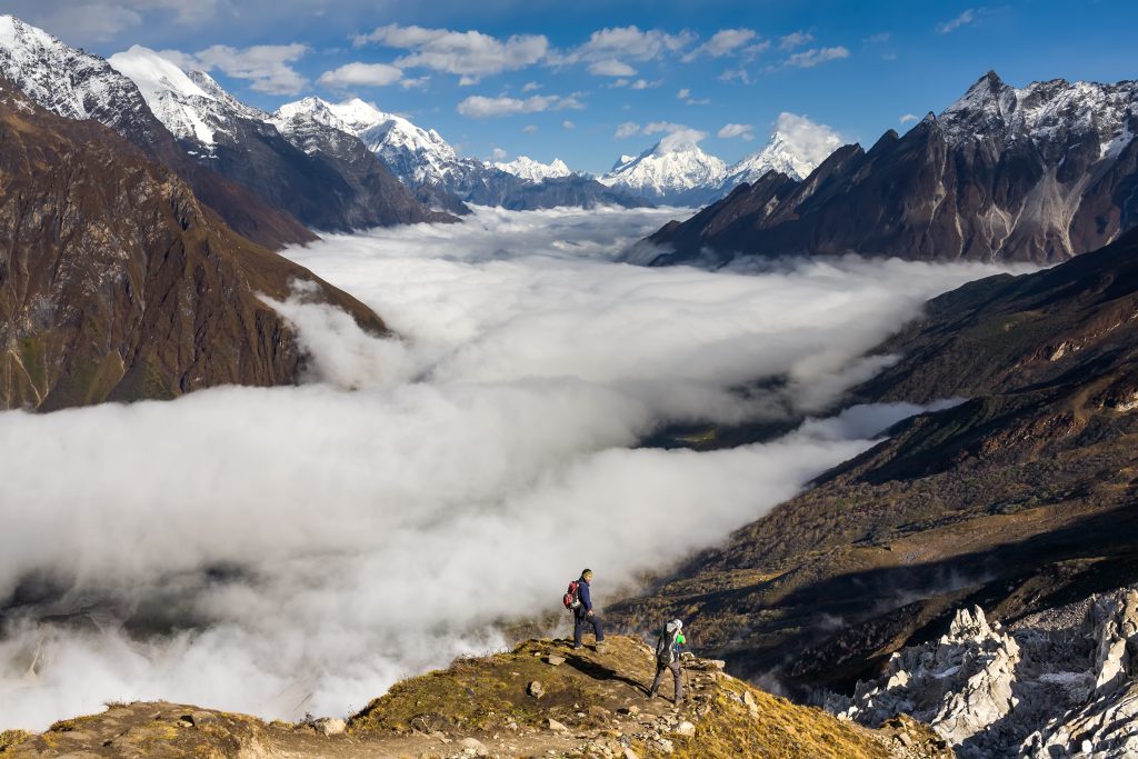 Trekker on the way to the valley covered with cloud on Manaslu c